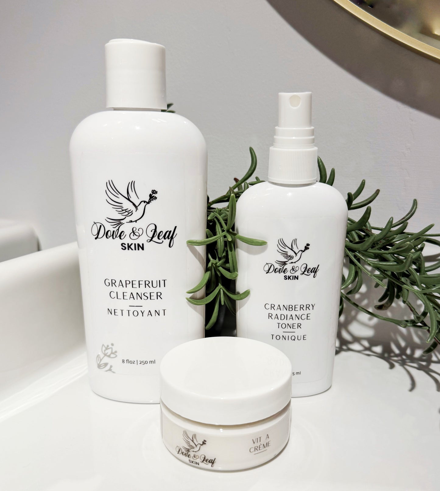 white cosmetic bottles from dove & leaf skin. Canadian natural skincare