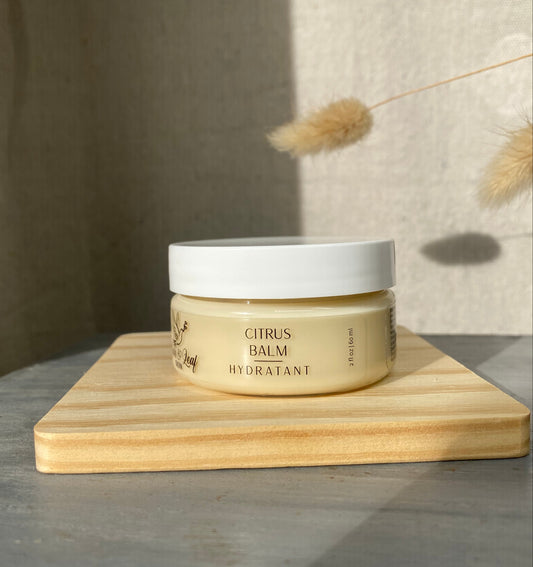 Cosmetic jar on a wooden block with a neutral background